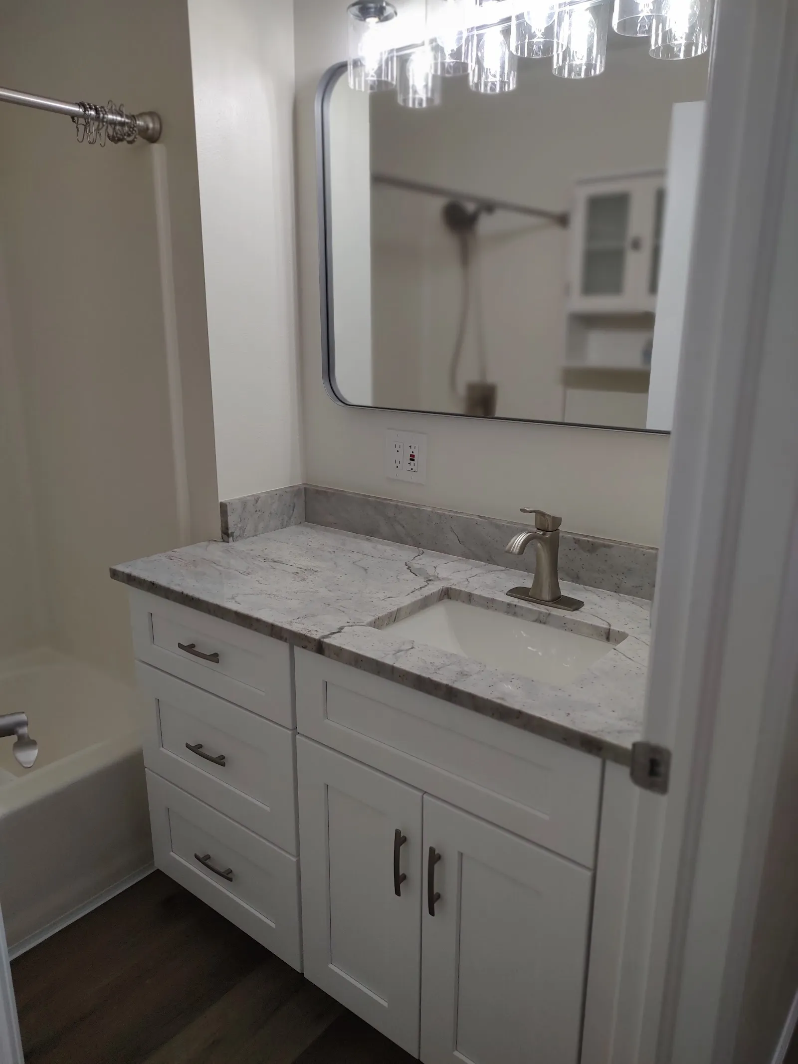 Remodeled bathroom vanity with a new sink and faucet